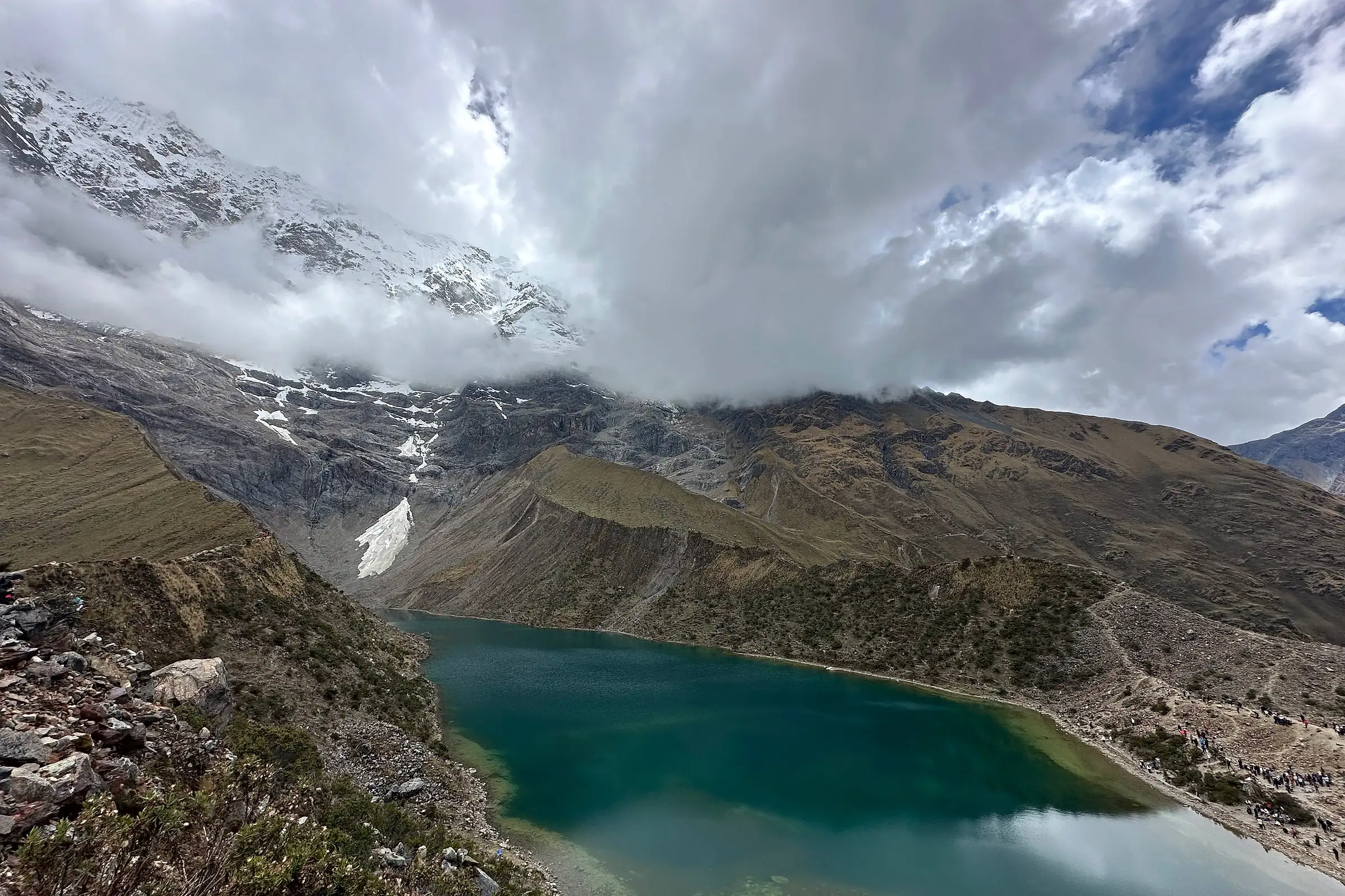 Humantay glacial lake below a snow-covered peak on the Andean crossing in Peru