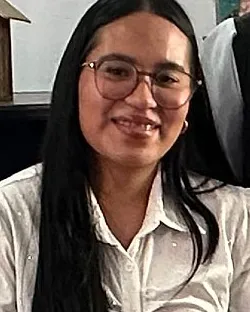 Katty Lopez, travel agent at Latin Lands, smiling in the Quito office