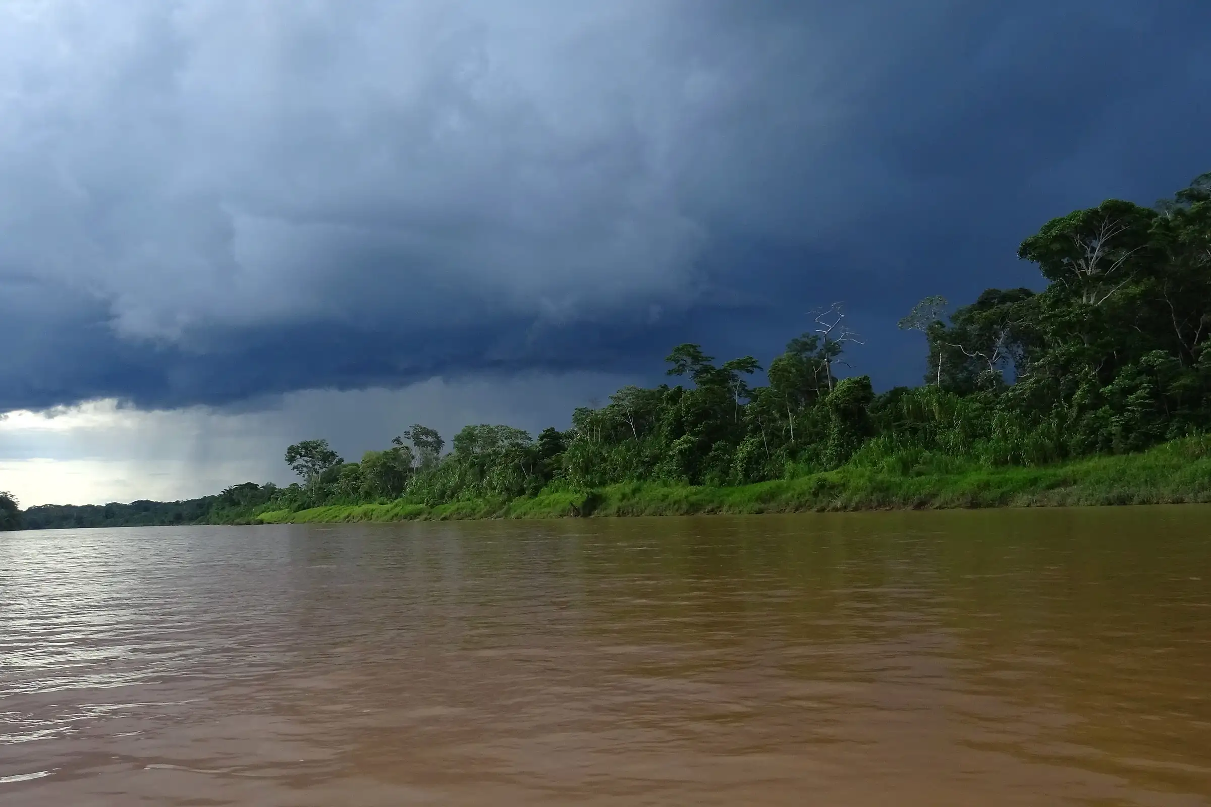A storm building over the forest on the banks of the Tambopata River in the Peruvian Amazon